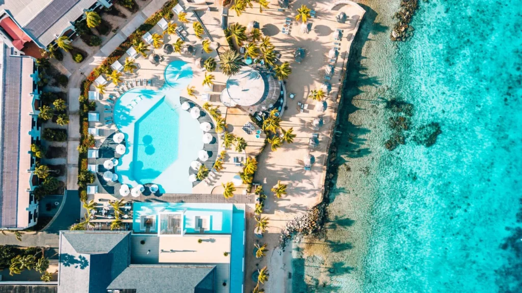 Swimming pool next to private beach